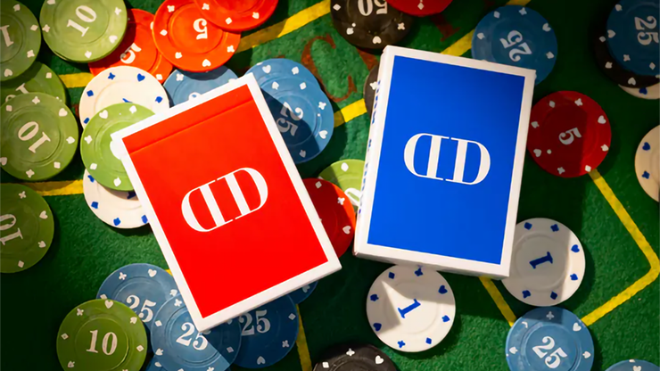 Red and blue Smoke & Mirrors 1984 decks on a green casino table with poker chips