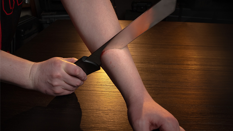Knife Through Arm