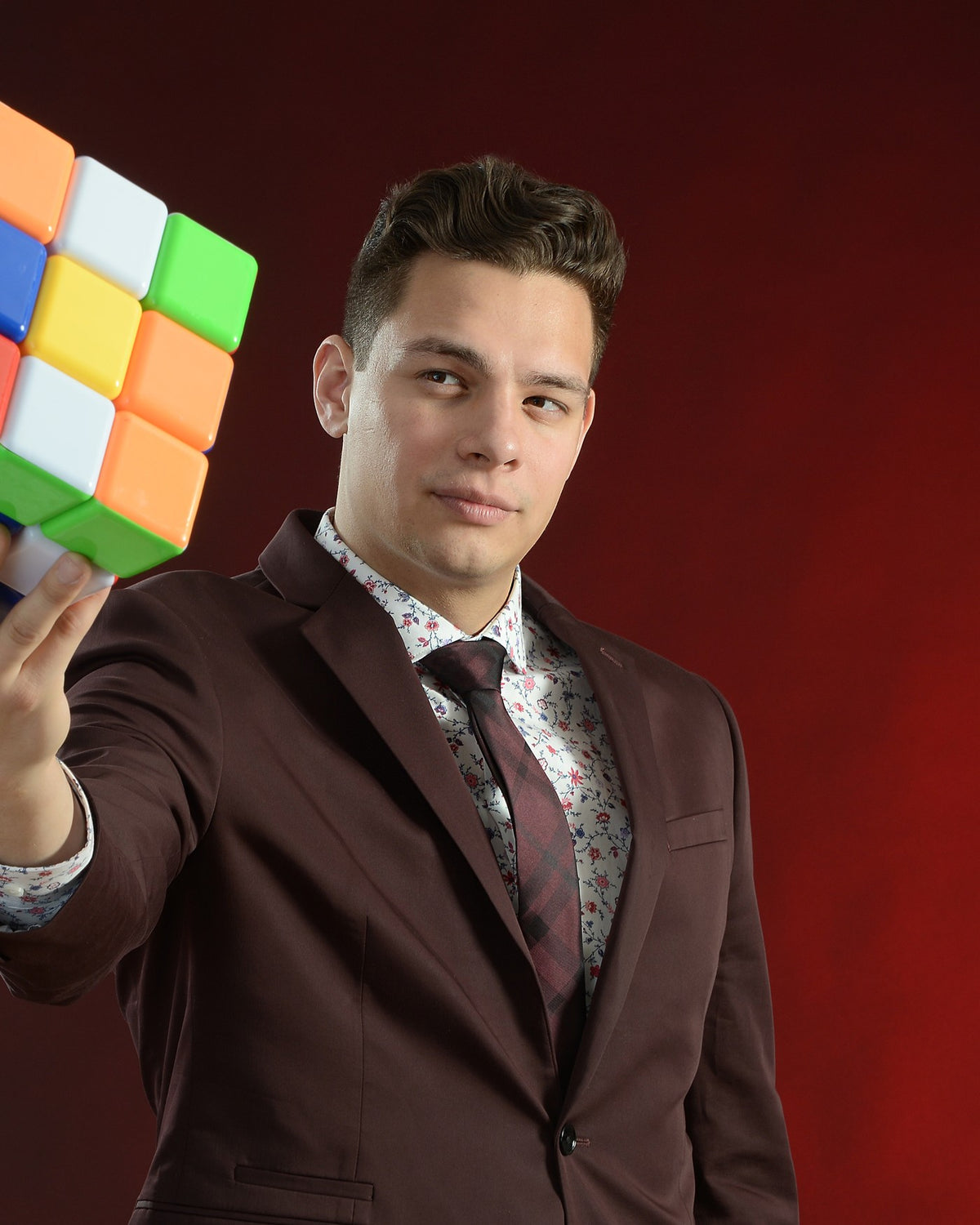 Steven Brundage holding out a Rubik's Cube